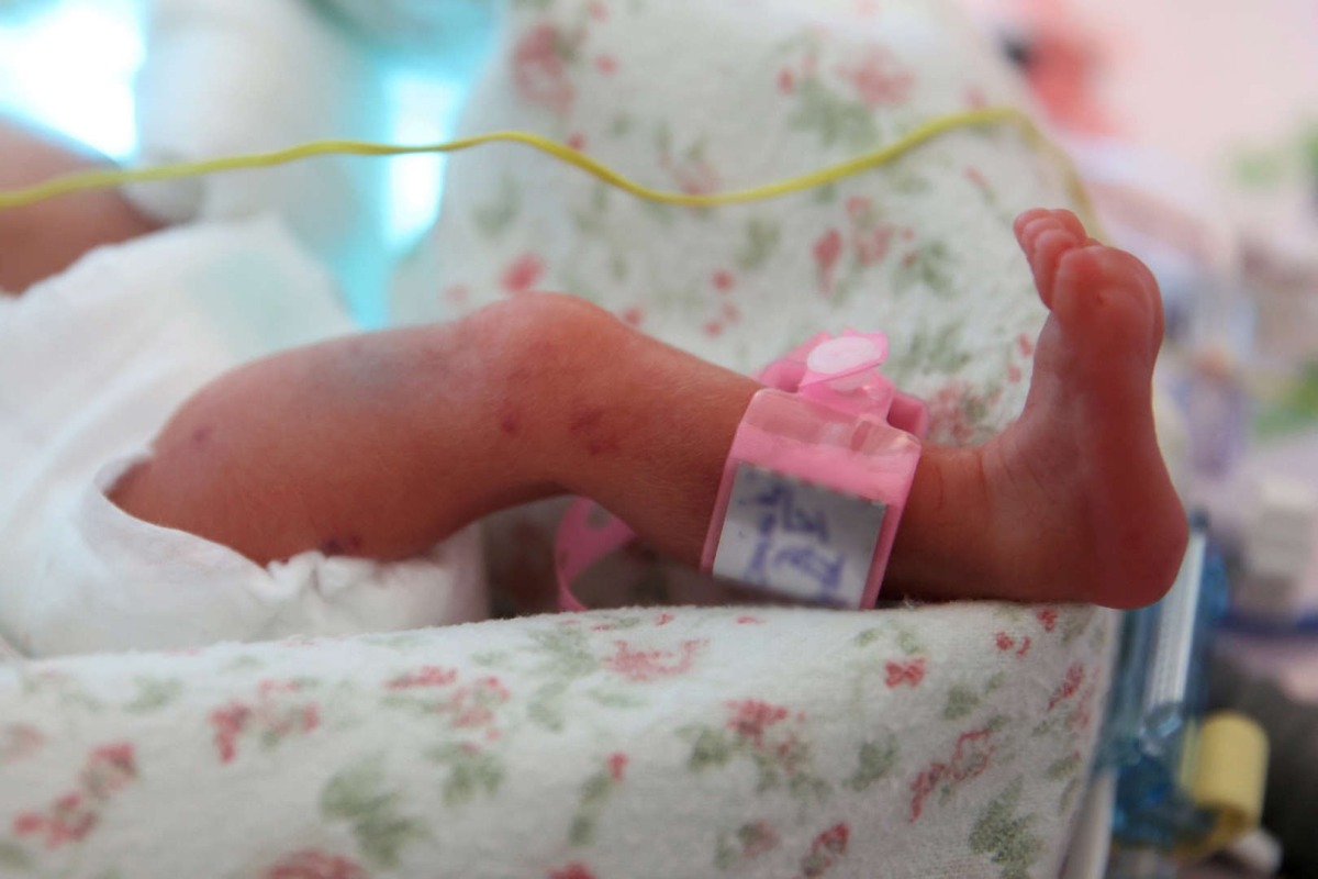 A newborn baby of a set of quintuplets lies in an incubator at the Obstetrics Department of the University Hospital in Krakow, southern Poland, 14 February 2023. Credit:Lukasz Gagulski / Avalon