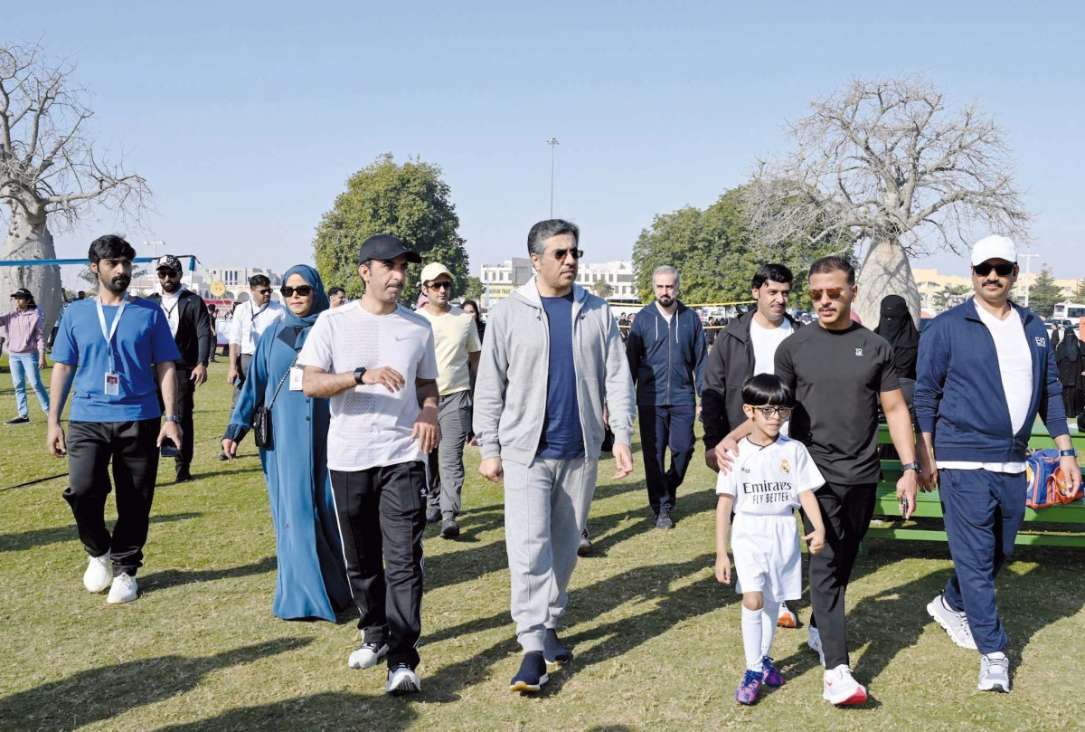 Minister of Labour H E Dr. Ali bin Smaikh Al Marri (centre) participating in an activity organised by the Ministry at Aspire Zone, yesterday.