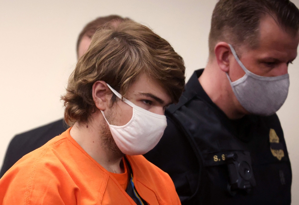 (FILES) In this file photo taken on May 19, 2022, Payton Gendron arrives for a hearing at the Erie County Courthouse in Buffalo, New York. - A man in court on February 15, 2023, lunged at the Gendron, 19, who murdered 10 Black people during a live-streamed supermarket rampage in Buffalo, New York, on May 14, 2022, disrupting the sentencing hearing for the self-declared white supremacist. (Photo by SCOTT OLSON / GETTY IMAGES NORTH AMERICA / AFP)