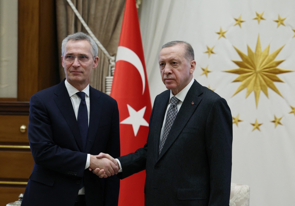 A photograph taken and released by the Turkish Presidential Press Office on February 16, 2023 shows Turkey's President Recep Tayyip Erdogan shaking hands with NATO Secretary General Jens Stoltenberg (L) in Ankara. (Photo by HANDOUT / TURKISH PRESIDENTIAL PRESS SERVICE / AFP)