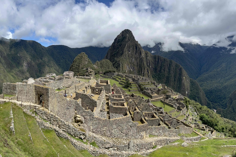 General view of the ancient Inca ruins of Machu Picchu in the Urubamba valley, seventy-two kilometres from the Andes city of Cusco, on February 15, 2023, open for the first time after they were closed to the public for security reasons on January 21, after protesters blocked the railways during protests against the government of President Dina Boluarte that have shaken the Andean country since December 7, 2022. (Photo by Carolina Paucar / AFP)