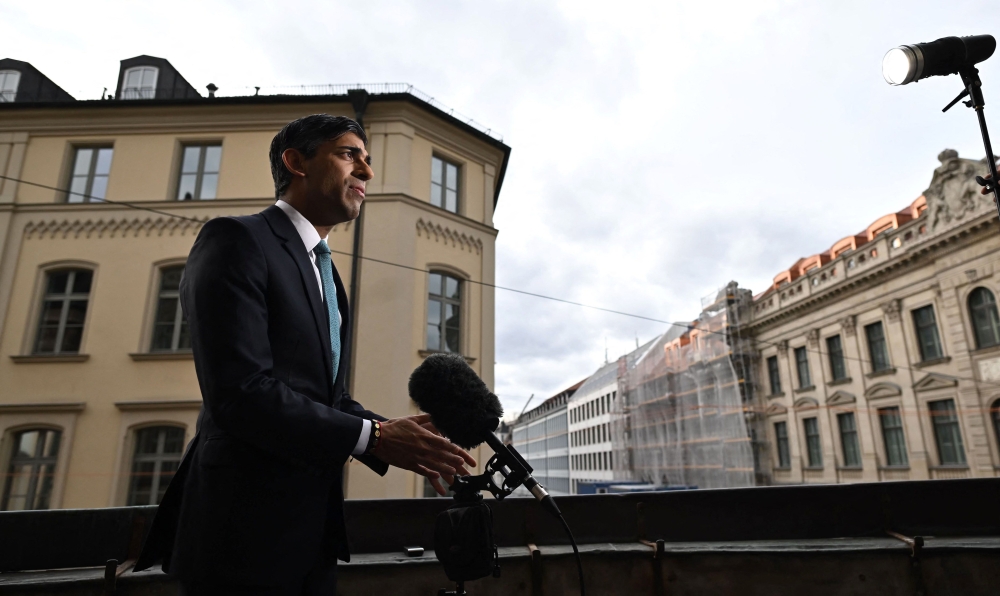 Britain's Prime Minister Rishi Sunak gives a tv interview on the sidelines of the Munich Security Conference (MSC) in Munich, southern Germany, on February 18, 2023.  (Photo by Ben Stansall / POOL / AFP)