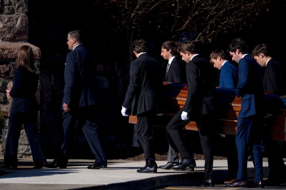 The casket is carried during the funeral for Brian Fraser on February 18, 2023 at St. Paul on the Lake Catholic Church in Grosse Pointe Farms, Michigan. Brian Fraser was one of three students killed in the shooting that occurred at Michigan State University on Monday, February 13, 2023. Nic Antaya/Getty Images/AFP