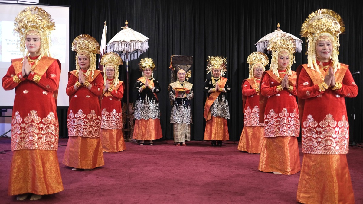 Indonesian community members take part in an activity held to promote Minang culture.