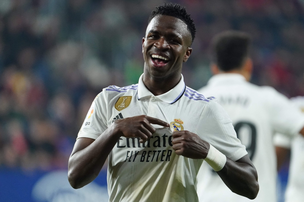 Real Madrid's Brazilian forward Vinicius Junior celebrates after scoring a goal that was later annuled during the Spanish League football match between CA Osasuna and Real Madrid CF at El Sadar stadium in Pamplona, on February 18, 2023. (Photo by CESAR MANSO / AFP)