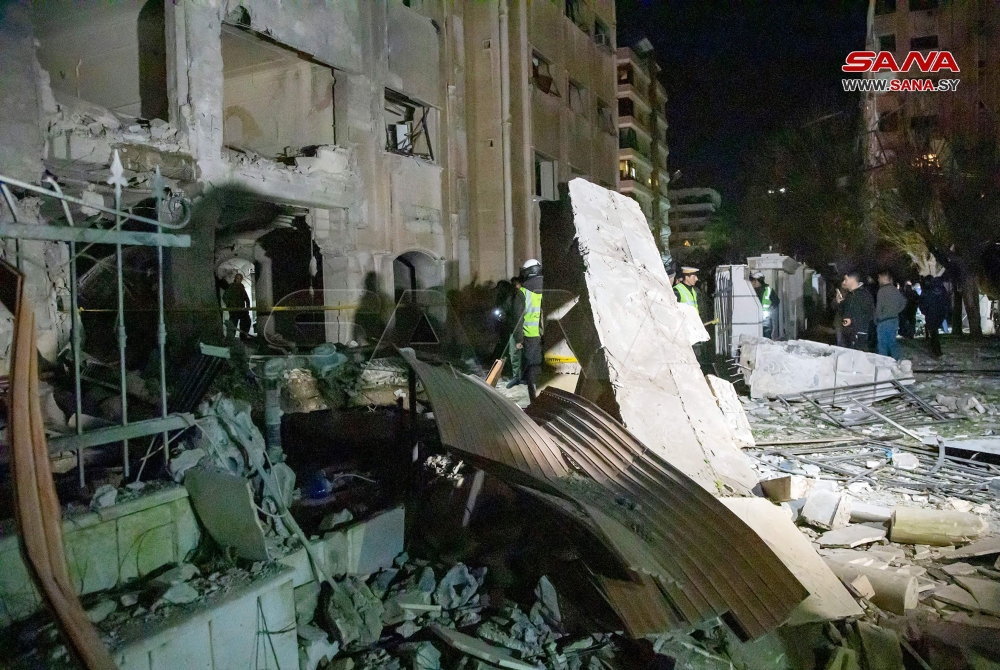 A handout picture taken and released on February 19, 2023 by the official Syrian Arab News Agency (SANA) shows a damaged building following an Israeli missile strike.
