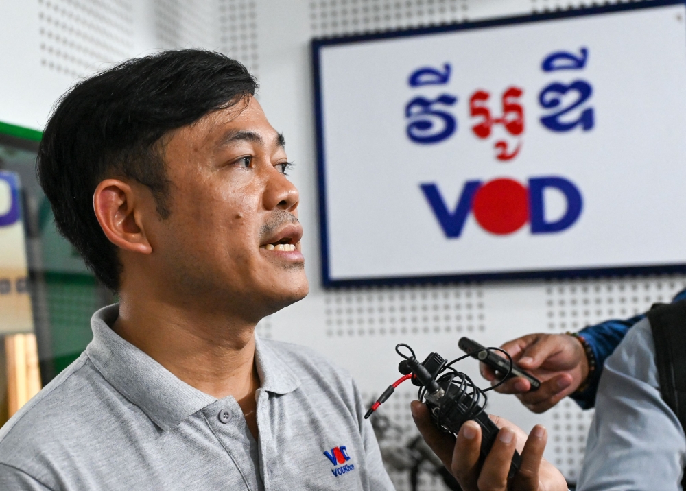 Ith Sothoeuth, media director of the Cambodian Centre for Independent Media (CCIM) which oversees VOD, speaks to media at his office in Phnom Penh on February 13, 2023, after Cambodian Prime Minister said VOD would have its operating licence revoked. (Photo by TANG CHHIN Sothy and TANG CHHIN SOTHY / AFP)