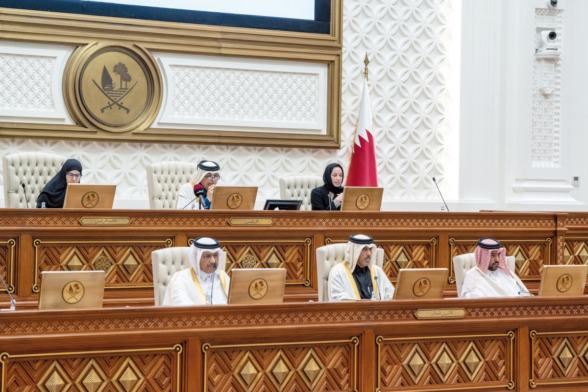 Speaker of Shura Council H E Hassan bin Abdullah Al Ghanim (top centre), Deputy Speaker H E Dr. Hamda bint Hassan Al Sulaiti (left) and Minister of Education and Higher Education H E Buthaina bint Ali Al Jabr Al Nuaimi during the session of the Council, yesterday.
