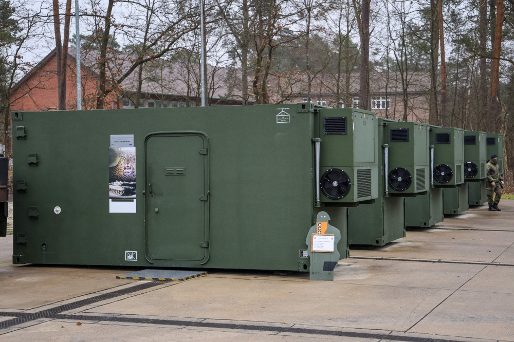 Containers with tank simulators of the German Army (Bundeswehr) are pictured at the Armoured Corps Training Centre (Panzertruppenschule) in Munster, northern Germany, on February 20, 2023.  Photo by FOCKE STRANGMANN / AFP