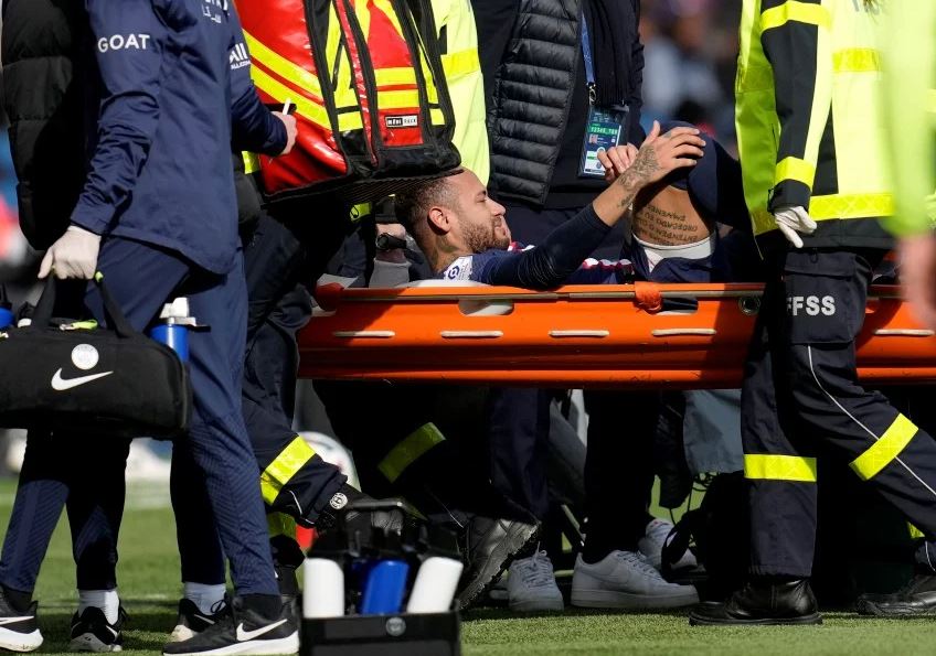 PSG's Neymar is carried off the field on a stretcher after suffering from an injury during the match against Lille at the Parc des Princes stadium, in Paris, France. (AFP)