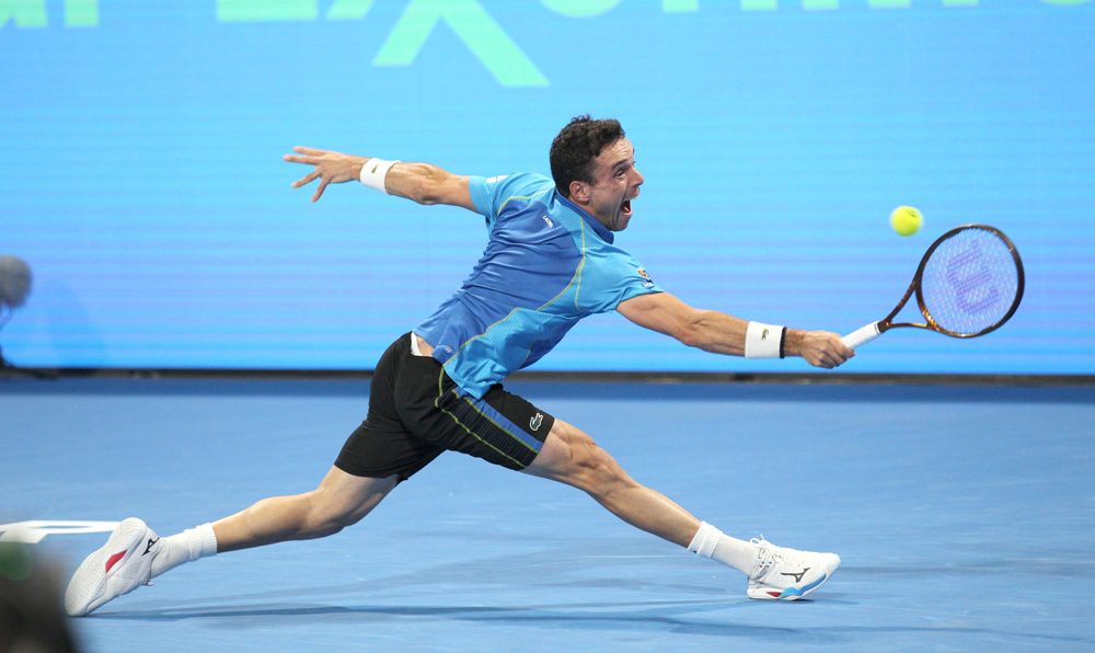 Spain's Roberto Bautista Agut in action against Hungary's Marton Fucsovics during their Qatar ExxonMobil Open Round of 32 match played at the Khalifa International Tennis & Squash Complex, yesterday. Pictures. Salim Matramkot/The Peninsula