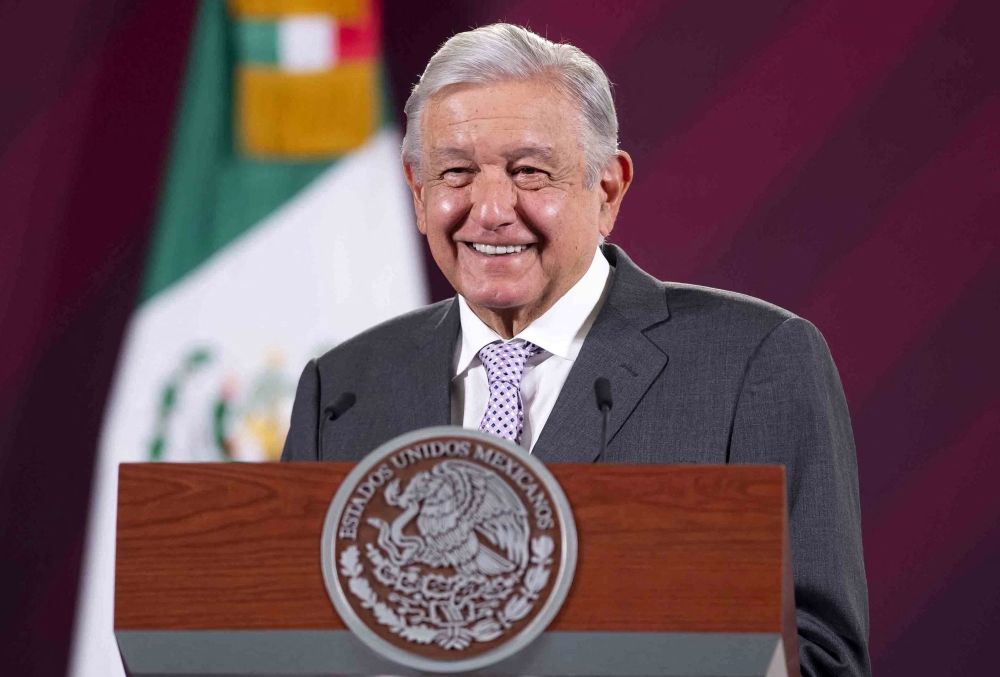 Handout picture released by the Mexican Presidency showing Mexican President Andres Manuel Lopez Obrador smiling during a press conference in Mexico City, on February 22, 2023. (Photo by Mexican Presidency / AFP) /