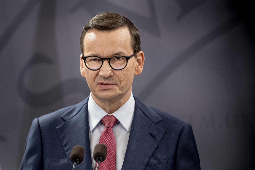 Poland's Prime Minister Mateusz Morawiecki speaks during a press conference with Denmark's Prime Minister after a meeting at Christiansborg Castle, the Danish Parliament building, in Copenhagen, Denmark, on February 23, 2023. (Photo by Liselotte Sabroe / Ritzau Scanpix / AFP)