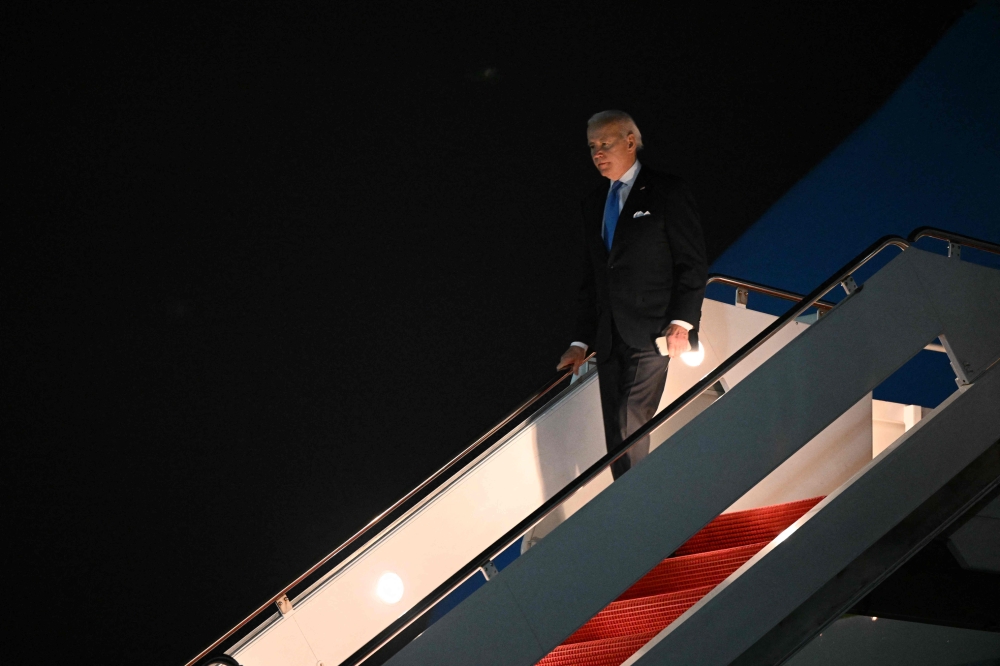 US President Joe Biden steps off Air Force One upon arrival at Joint Base Andrews in Maryland on February 22, 2023. - Biden is returning to the White House following a surprise visit to Kyiv, Ukraine, and a three day trip to Warsaw, Poland. (Photo by Mandel NGAN / AFP)