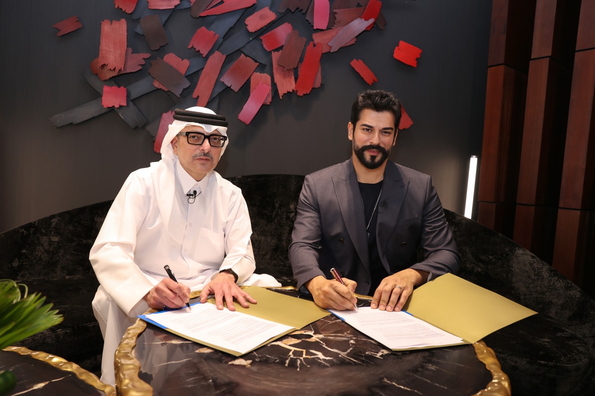 Vice Chairman & EVP of Ali Bin Ali Holding Nabeel Ali Bin Ali (left) and Turkish model and actor Burak Özçivit during the agreement signing. 