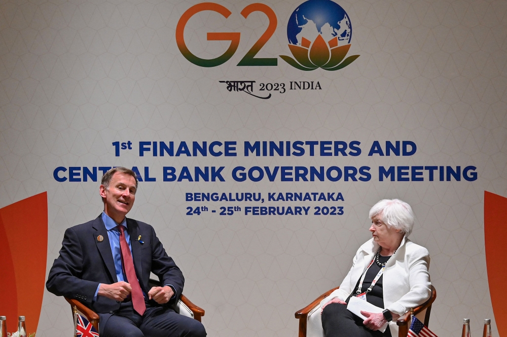 British Finance Minister, Jeremy Hunt (L) and Treasury Secretary of the United States of America, Janet Yellen take part in a bilateral conference on the sidelines of G20 Finance Ministers and Central Bank Governors meeting under India's G20 Presidency in Bengaluru on February 24, 2023. (Photo by Manjunath KIRAN / AFP)
