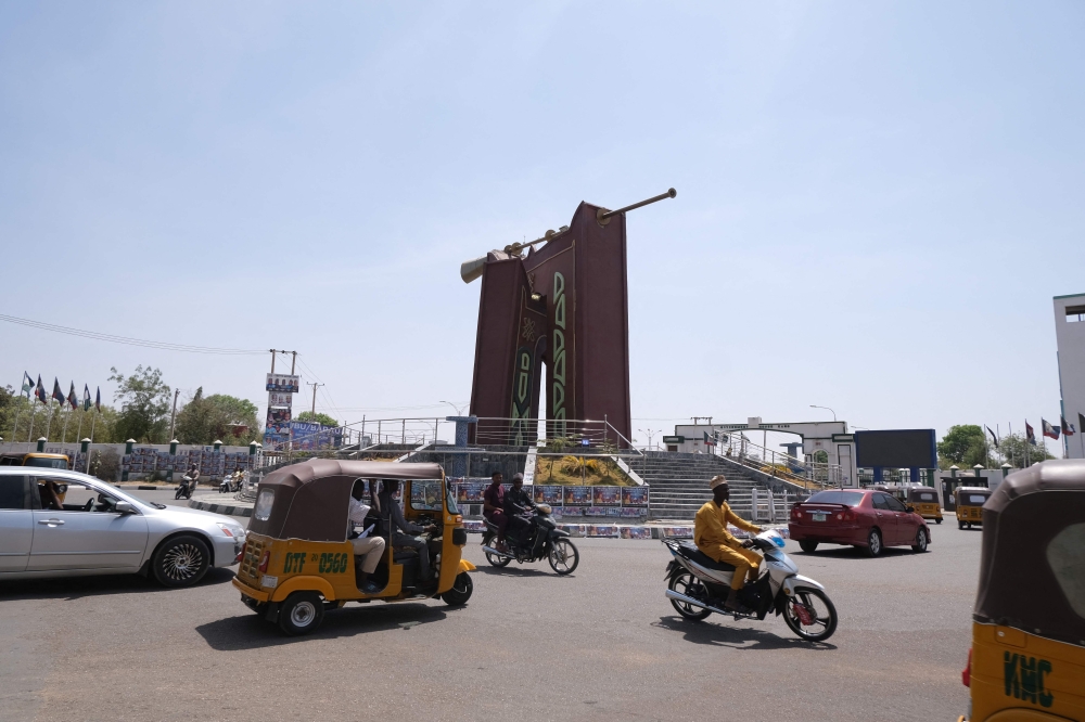 Motorist drive in Kano, Nigeria on February 24, 2023, ahead of the Nigerian presidential elections scheduled for February 25, 2023. (Photo by KOLA SULAIMON / AFP)
