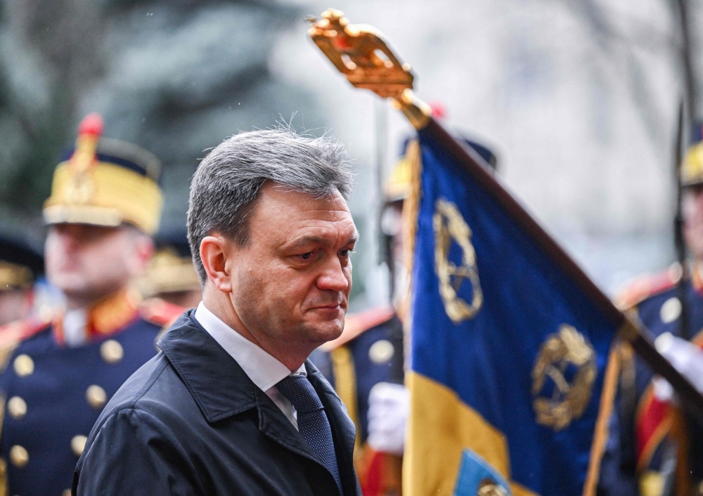 Moldovan Prime Minister Dorin Recean attends an official welcoming ceremony with his Romanian counterpart (not in picture) at Victoria Palace, the Romanian Government headquarters in Bucharest March 1, 2023. (Photo by Daniel MIHAILESCU / AFP)