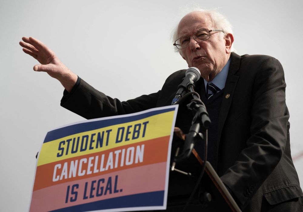 US Senator Bernie Sanders (I-VT) speaks at a protest in front of the Supreme Court during a rally for student debt cancellation in Washington, DC, on February 28, 2023. (Photo by ANDREW CABALLERO-REYNOLDS / AFP)