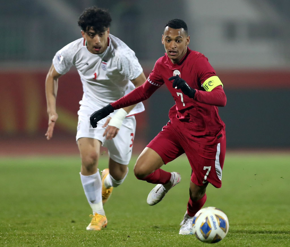 Action during the match between Qatar and Iran yesterday.