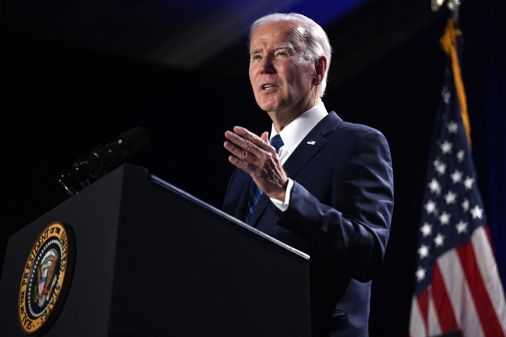 US President Joe Biden gestures as he speaks during the House Democratic Caucus Issues Conference at the Hyatt Regency Inner Harbor in Baltimore, Maryland, on March 1, 2023. (Photo by Andrew Caballero-Reynolds / AFP)