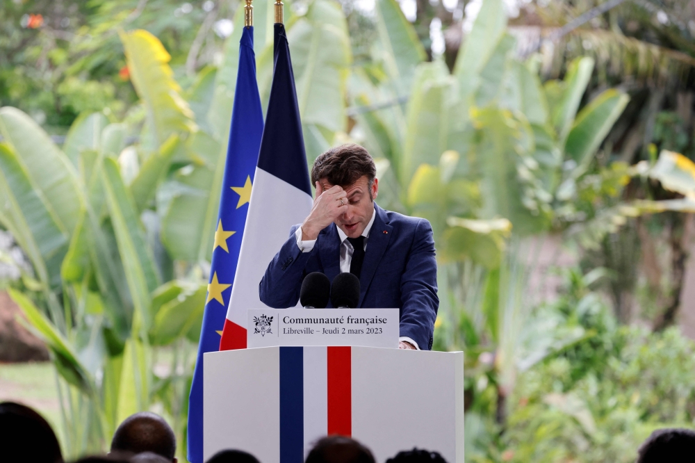 French President Emmanuel Macron delivers his speech to the French community at the residence of the French Ambassador in Libreveille on March 2, 2023. (Photo by LUDOVIC MARIN / AFP)