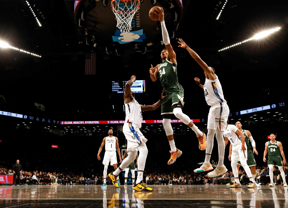 Giannis Antetokounmpo #34 of the Milwaukee Bucks shoots against Nic Claxton #33 of the Brooklyn Nets during their game at Barclays Center on February 28, 2023 in New York City.  Al Bello/Getty Images/AFP