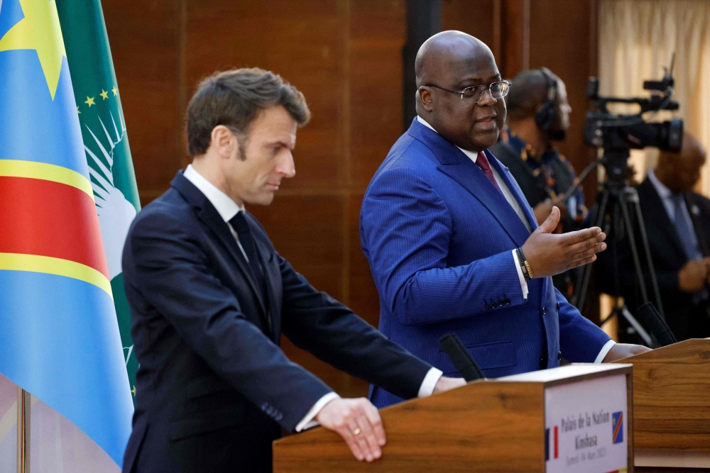 Democratic Republic of Congo's President Felix Tshisekedi (R) and France's President Emmanuel Macron hold a press conference during their meeting at the Palace of the Nation in Kinshasa, on March 4, 2023. (Photo by Ludovic Marin / AFP)