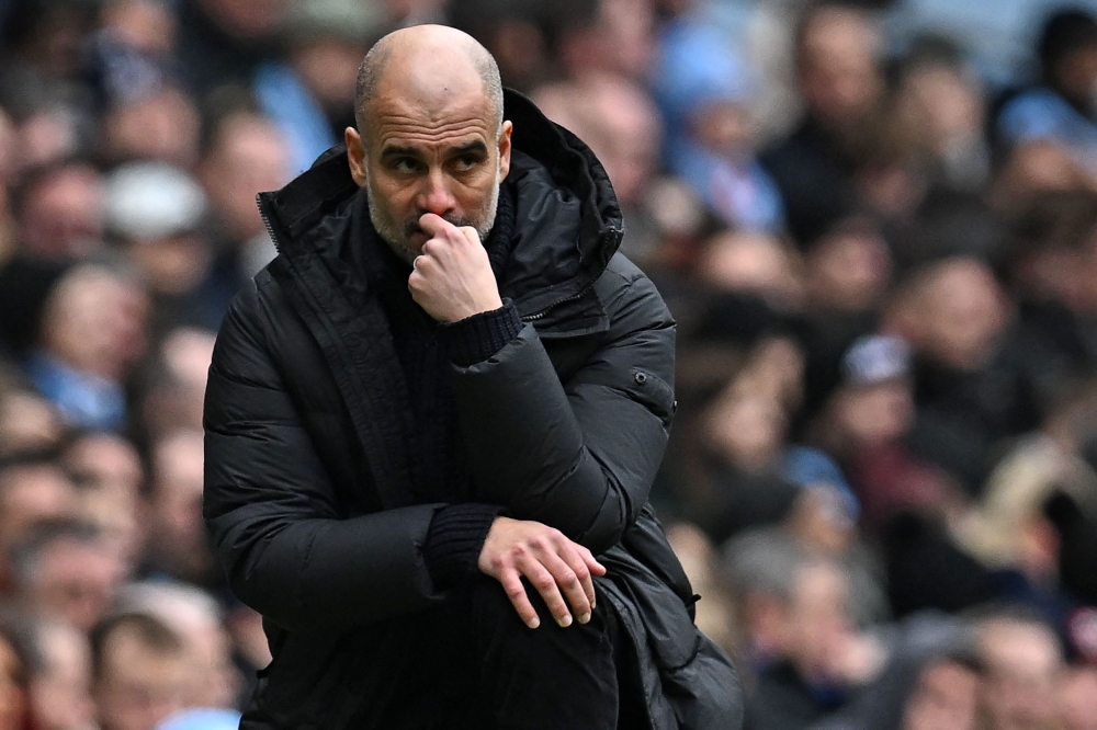 Manchester City's manager Pep Guardiola looks on during the English Premier League match between Manchester City and Newcastle United at the Etihad Stadium in Manchester, north west England, on March 4, 2023. (Photo by Paul ELLIS / AFP)