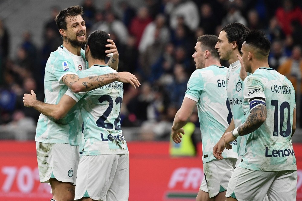 Inter Milan's Armenian midfielder Henrikh Mkhitaryan (second left) celebrates with Inter Milan's Italian defender Francesco Acerbi after opening the scoring during the Italian Serie A football match between Inter and Lecce on March 5, 2023 at the San Siro (Giuseppe-Meazza) stadium in Milan. (Photo by Isabella BONOTTO / AFP)