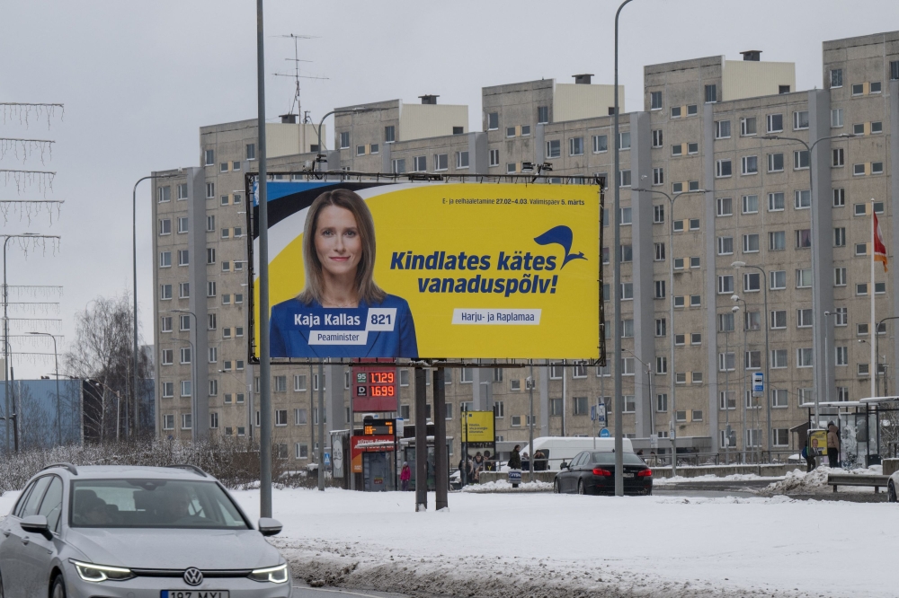 An election poster featuring Prime Minister Kaja Kallas of the Reform Party is seen in Viimsi, Estonia on March 5, 2023 during parliamentary elections. - According to the polls, the elections are set to be won by the Reform Party of Prime Minister Kaja Kallas, who has led international calls for increased military assistance to Ukraine. (Photo by RAIGO PAJULA / AFP)