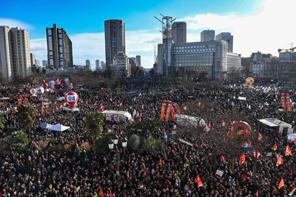 In this file photo taken on January 31, 2023, protesters gather at Place d'Italie square for a rally on a second day of nationwide strikes and protests over the government's proposed pension reform, in Paris. (Photo by Alain JOCARD / AFP)