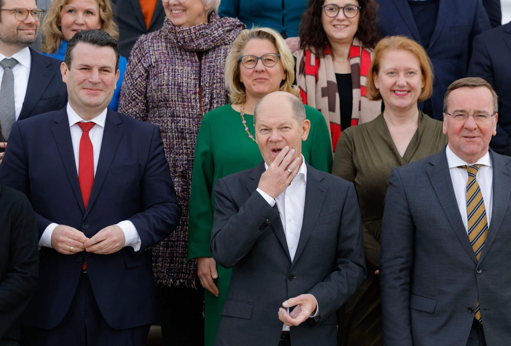 German Chancellor Olaf Scholz (first row, center) and members of his cabinet pose on the stairs of Schloss Meseberg palace in Meseberg near Gransee, northeastern Germany, at the end of the federal cabinet retreat on March 6, 2023. (Photo by Odd ANDERSEN / AFP)