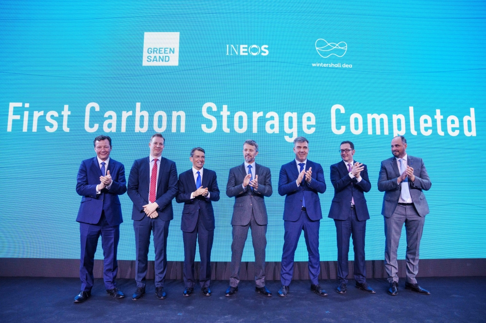 (L-R) David Bucknell, CEO INEOS Energy, Mads Gade, CEO INEOS Energy Danmark, Brian Gilvary, chairman of the board INOES Energy, Denmark's crown prince Frederik, Lars Aagaard Moller, Denmark's Minister for Climate, Energy and Utilities, Mario Mehren, CEO Wintershall Dea and Hugo Dijkgraaf, CTO Wintershall Dea, applaud on stage during the launch of the Greensand Project, an offshore carbon dioxide storage, in Esbjerg on March 8, 2023. (Photo by Bo Amstrup / Ritzau Scanpix / AFP)
