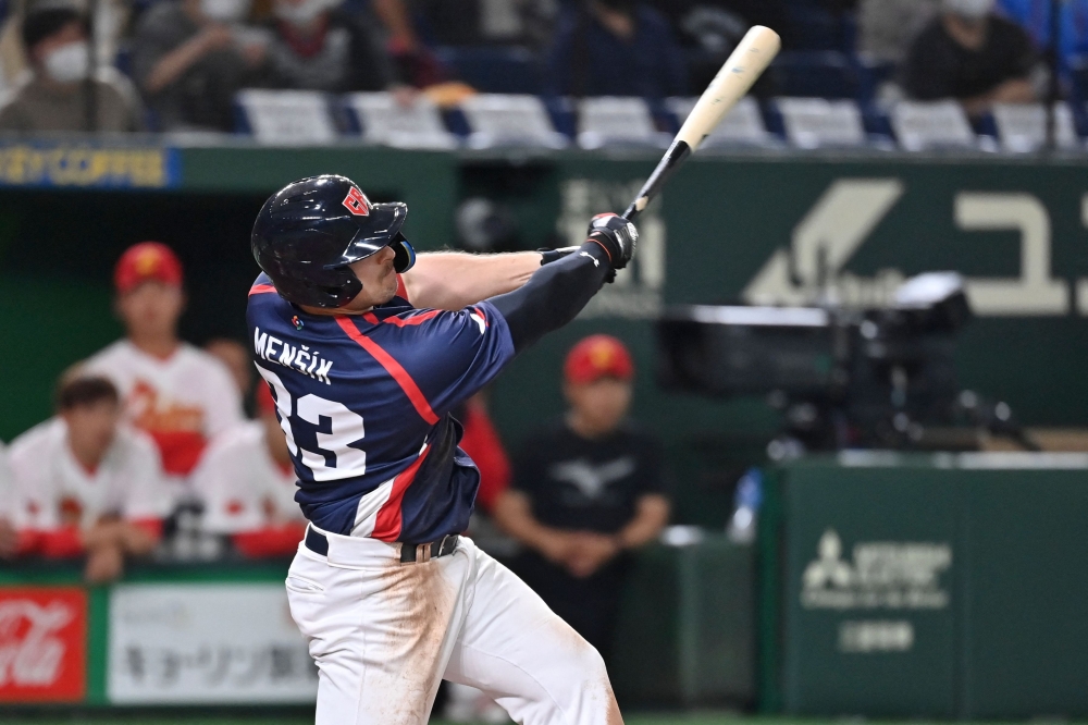 Czech Republic's Matej Mensik hits a double during the World Baseball Classic (WBC) Pool B round game between Czech Republic and China at the Tokyo Dome in Tokyo on March 10, 2023. (Photo by Kazuhiro NOGI / AFP)