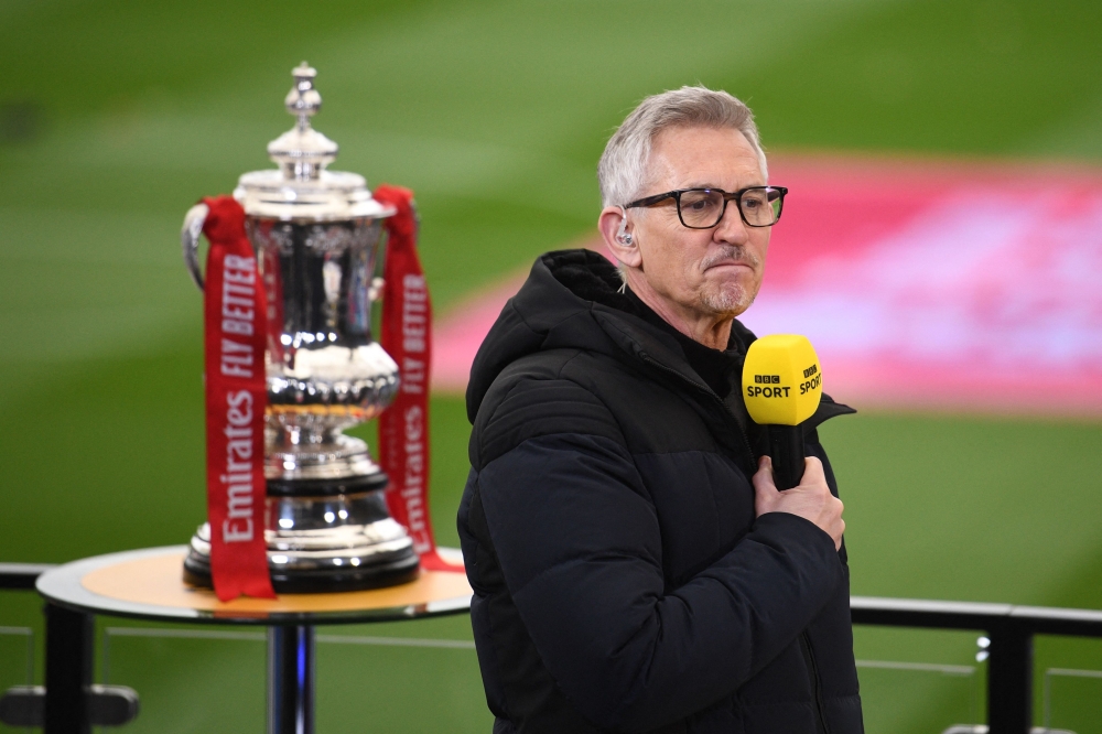 In this file photo taken on March 21, 2021, BBC TV presenter Gary Lineker prepares to broadcast inside the make-shift television studio ahead of the English FA Cup quarter-final football match between Leicester City and Manchester United at King Power Stadium in Leicester, central England.  (Photo by Oli SCARFF / POOL / AFP) 