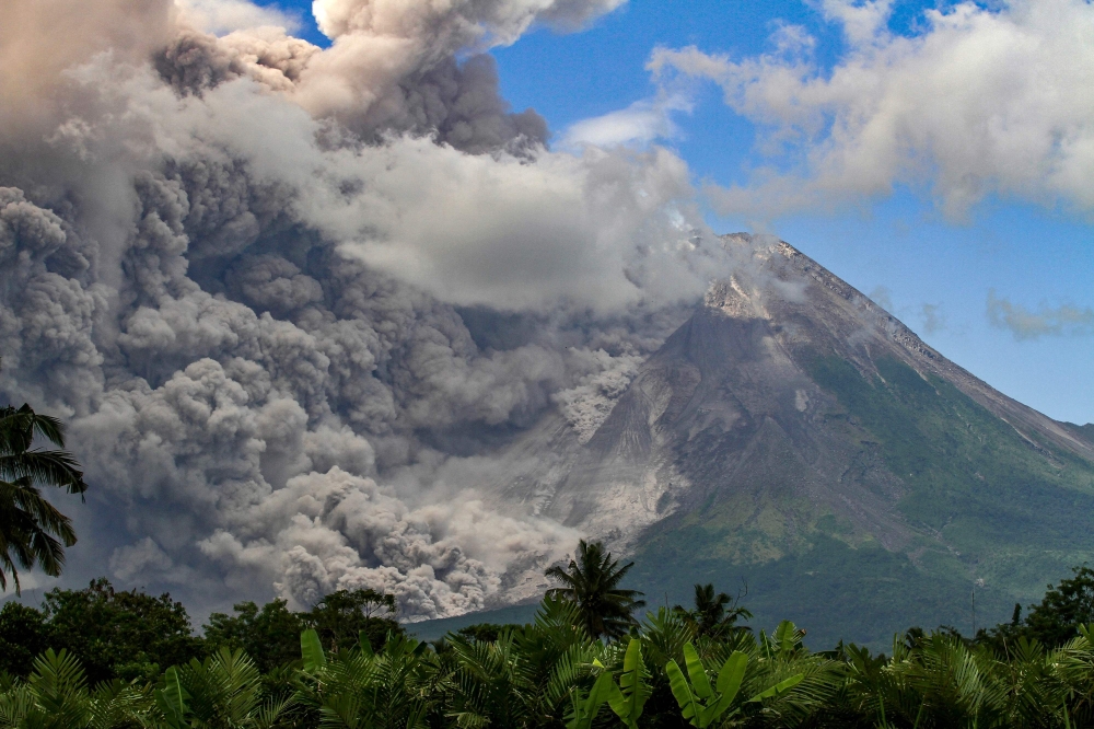 Thick smoke rises during an eruption from Mount Merapi, Indonesia痴 most active volcano, as seen from Tunggularum village in Sleman on March 11, 2023. (Photo by Devi Rahman / AFP)
 