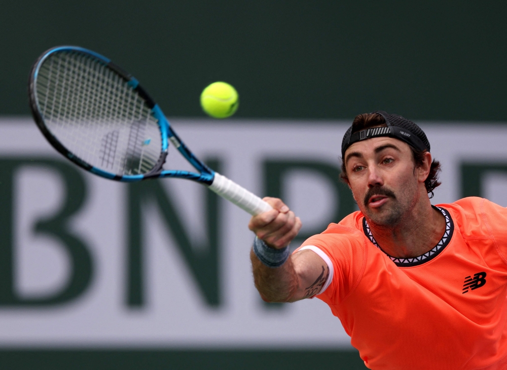 Jordan Thompson of Australia stretches for a forehand in his victory over Stefanos Tsitsipas of Greece during the BNP Parisbas at the Indian Wells Tennis Garden on March 10, 2023 in Indian Wells, California. Harry How/Getty Images/AFP