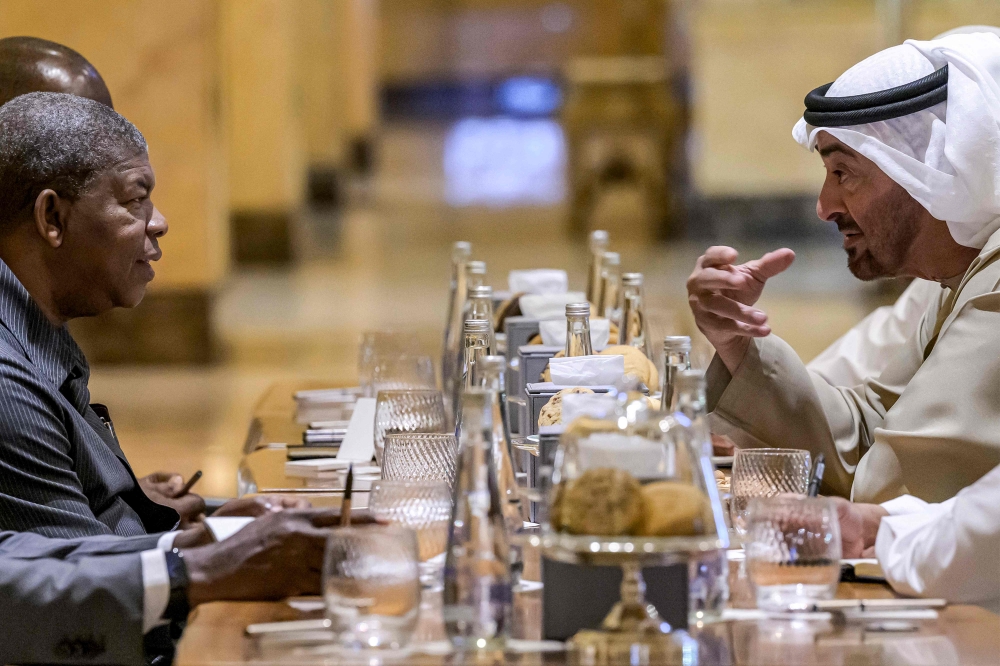 This handout image provided by the UAE Ministry Of Presidential Affairs shows UAE President Sheikh Mohamed bin Zayed al-Nahyan (right) meeting with Angola's President Joao Lourenco (left) at Emirates Palace in Abu Dhabi on March 11, 2023. (Photo by Hamad AL-KAABI / UAE's Ministry of Presidential Affairs / AFP) 