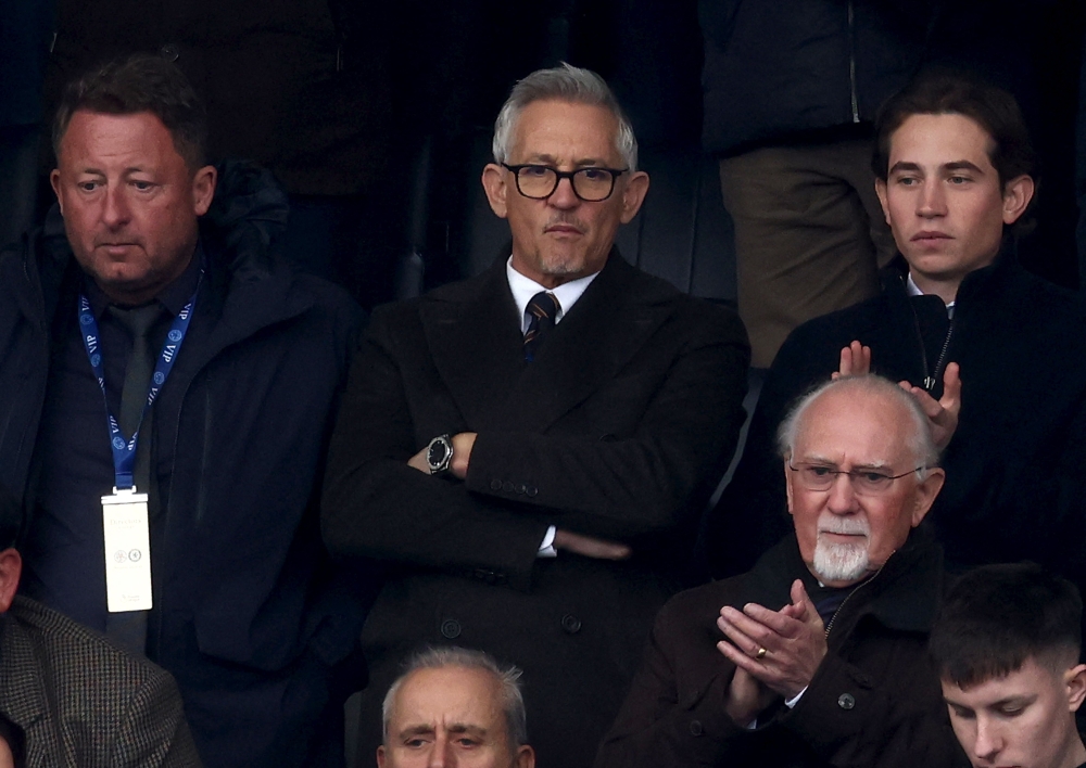 Gary Lineker (C), former England footballer turned sports TV presenter for the BBC, reacts as he waits in the stands ahead of kick-off in the English Premier League football match between Leicester City and Chelsea at King Power Stadium in Leicester, central England on March 11, 2023. (Photo by DARREN STAPLES / AFP)