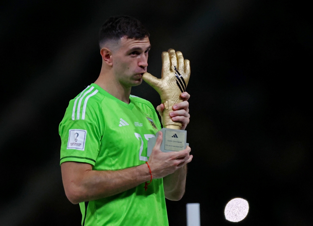 Argentina's Emiliano Martinez after he is awarded the golden glove award during the trophy ceremony of the FIFA World Cup Qatar 2022 at the Lusail Stadium on December 18, 2022. (REUTERS/Hannah Mckay)

