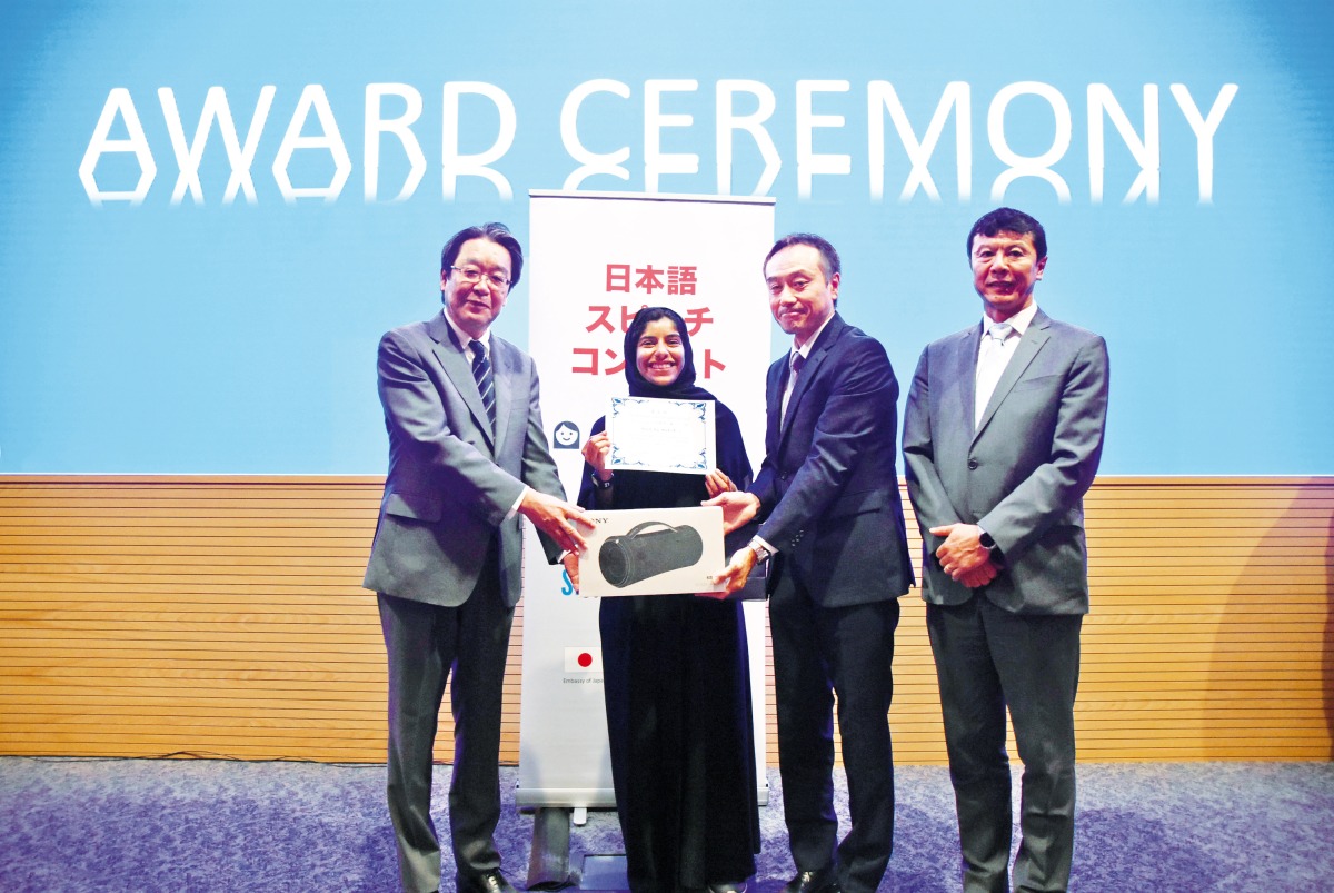 Ambassador of Japan to Qatar, H E Satoshi Maeda (left) handing the award certificate to Fatima Al Marzoqi, who topped the 14th Japanese Speech Contest, at Qatar University. 