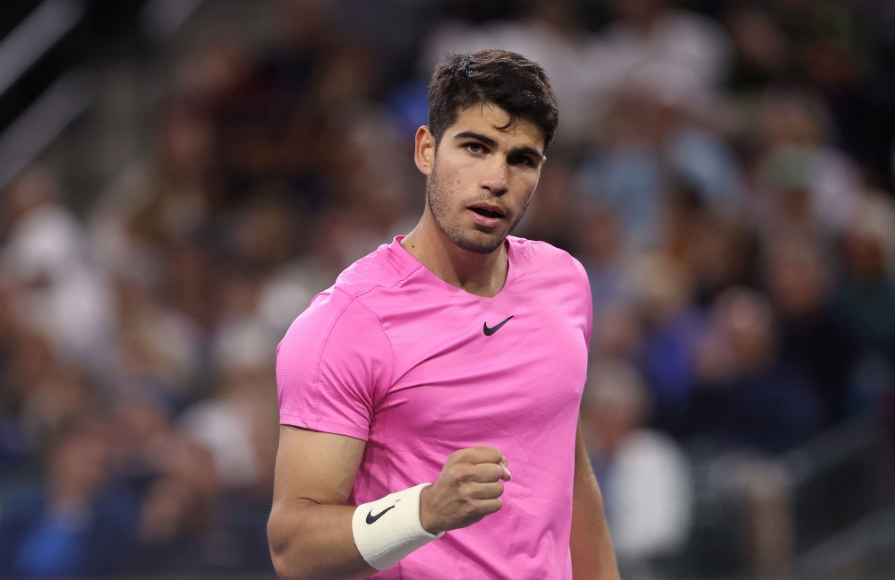 Carlos Alcaraz of Spain celebrates in his match against Tallon Griekspoor of Netherlands during the BNP Paribas Open on March 13, 2023 in Indian Wells, California. Julian Finney/Getty Images/AFP