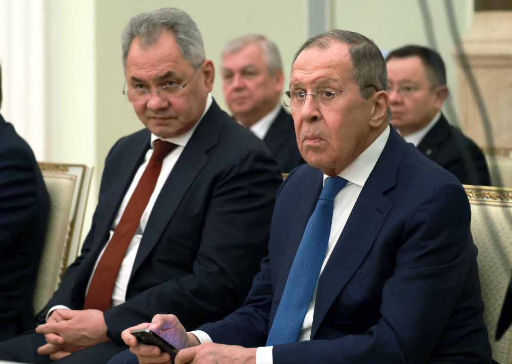 Russian Defence Minister Sergei Shoigu (left) and Foreign Minister Sergei Lavrov attend a meeting of Russia's President Vladimir Putin with his Syrian counterpart Bashar al-Assad (both not pictured) at the Kremlin in Moscow on March 15, 2023. (Photo by Vladimir GERDO / SPUTNIK / AFP)