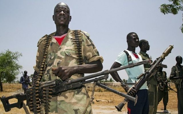 Members of the opposition troops hold weapons near their base in Thonyor, South Sudan, on April 11, 2017. File photo / AFP