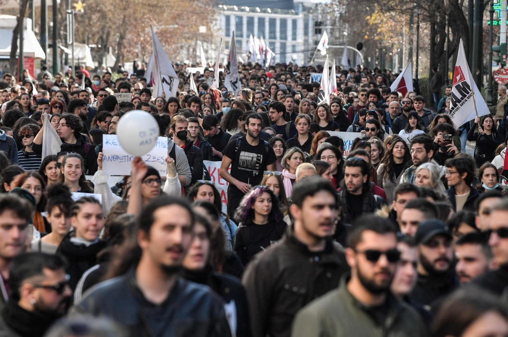 Protesters march during a demonstration of students and pupils in central Athens on March 3, 2023, following a deadly train accident near the city of Larissa. (Photo by Louisa Gouliamaki / AFP)

