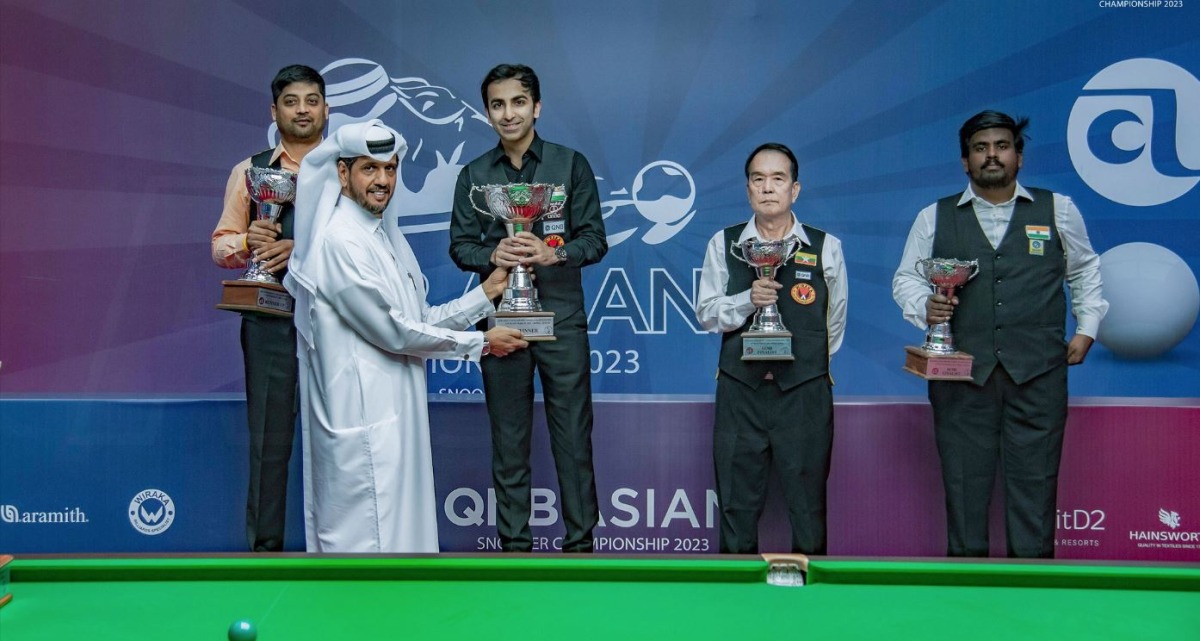 India's Pankaj Advani receives the winner's trophy during the presentation ceremony.