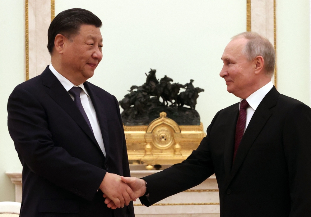Russian President Vladimir Putin meets with China's President Xi Jinping at the Kremlin in Moscow on March 20, 2023. (Photo by Sergei Karpukhin / Sputnik / AFP)