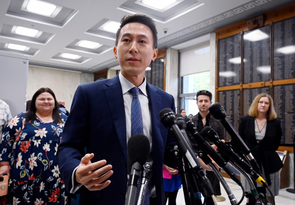 TikTok CEO Shou Zi Chew speaks to the press before testifying at the House Energy and Commerce Committee hearing on 