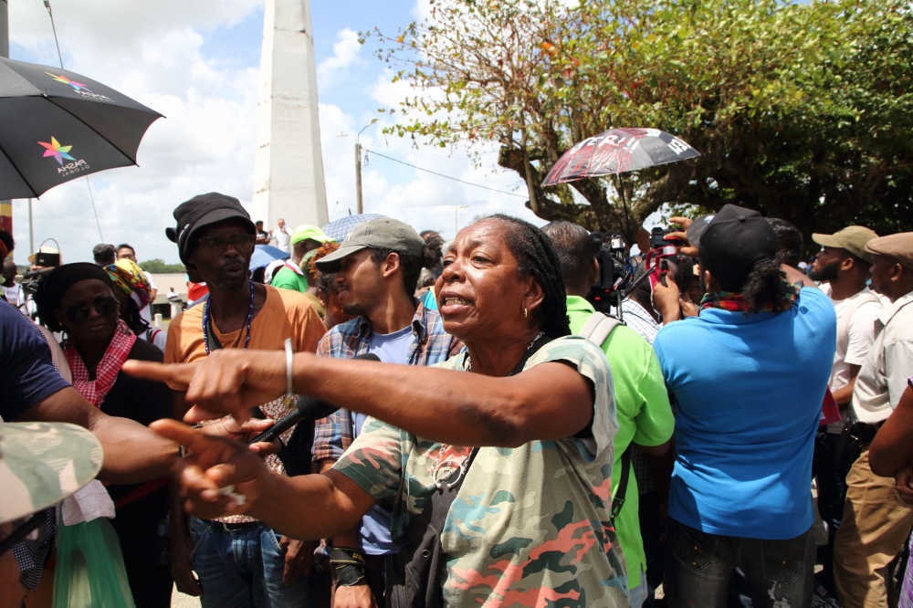 People take part in a protest to demand an electoral reform near the National Assembly in Paramaribo on March 24, 2023. (Photo by Ranu Abhelakh / AFP)